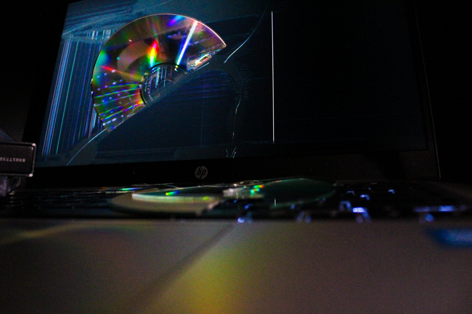Disc in laptop screen with refracted light